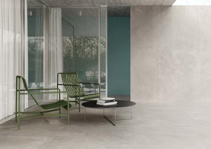 Green metal chairs on tiles terrace