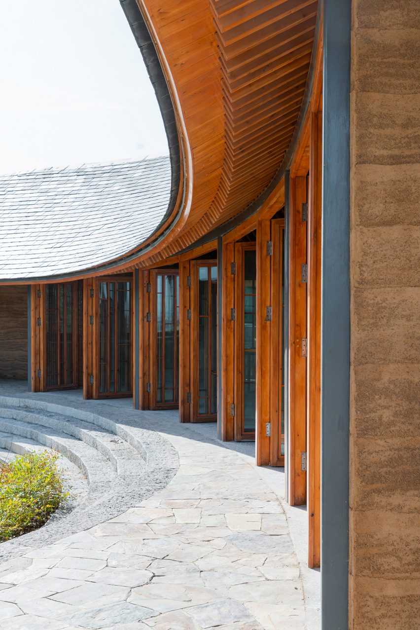 Timber building with a curving facade