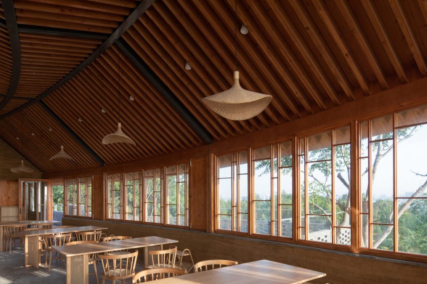 Timber restaurant interior overlooking a hillside