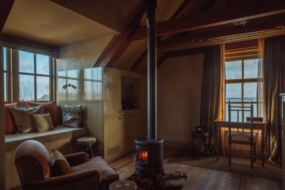 Fireplace in bedroom of hotel by Aedes