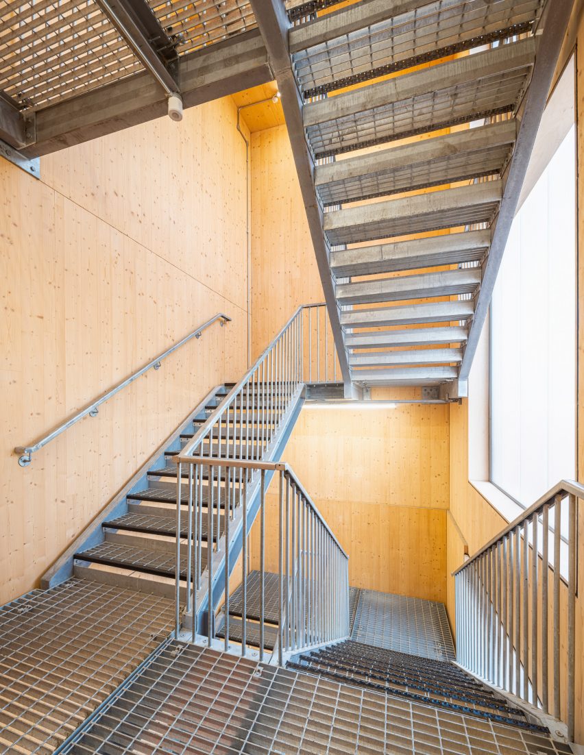 CLT interior with metal staircase at Workstack by dRMM