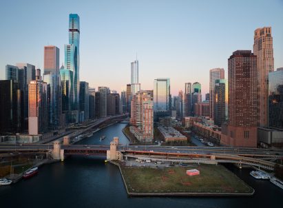 Chicago River with skyline and a pavilion on a park on the lake