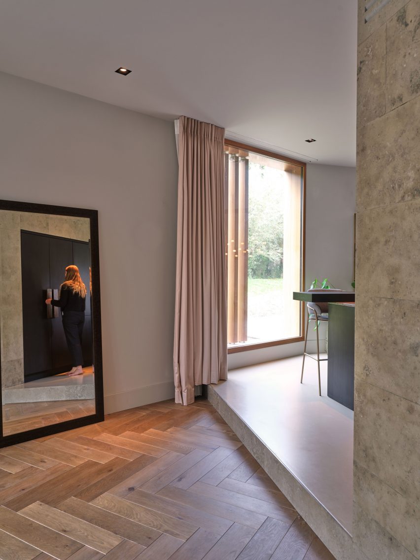 Kitchen and living room in Edge House by Studio Prototype