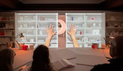 Projected hands pulling doors open