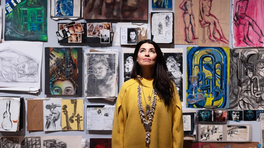 es devlin standing in front of her drawings