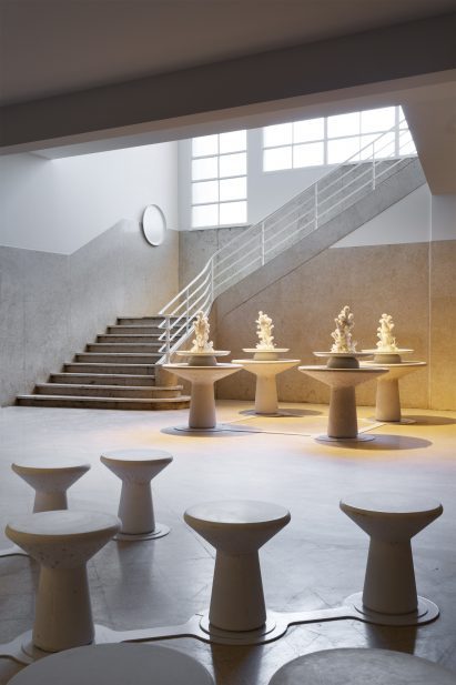 Four large podiums placed close to an imposing staircase