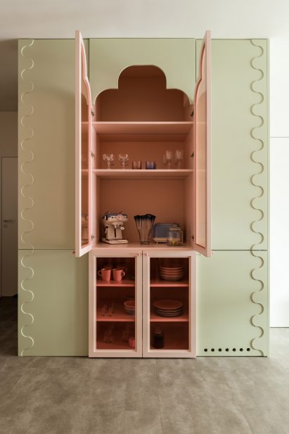 Decorative display cabinet with scalloped design details