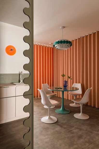 Circular dining table and white chairs