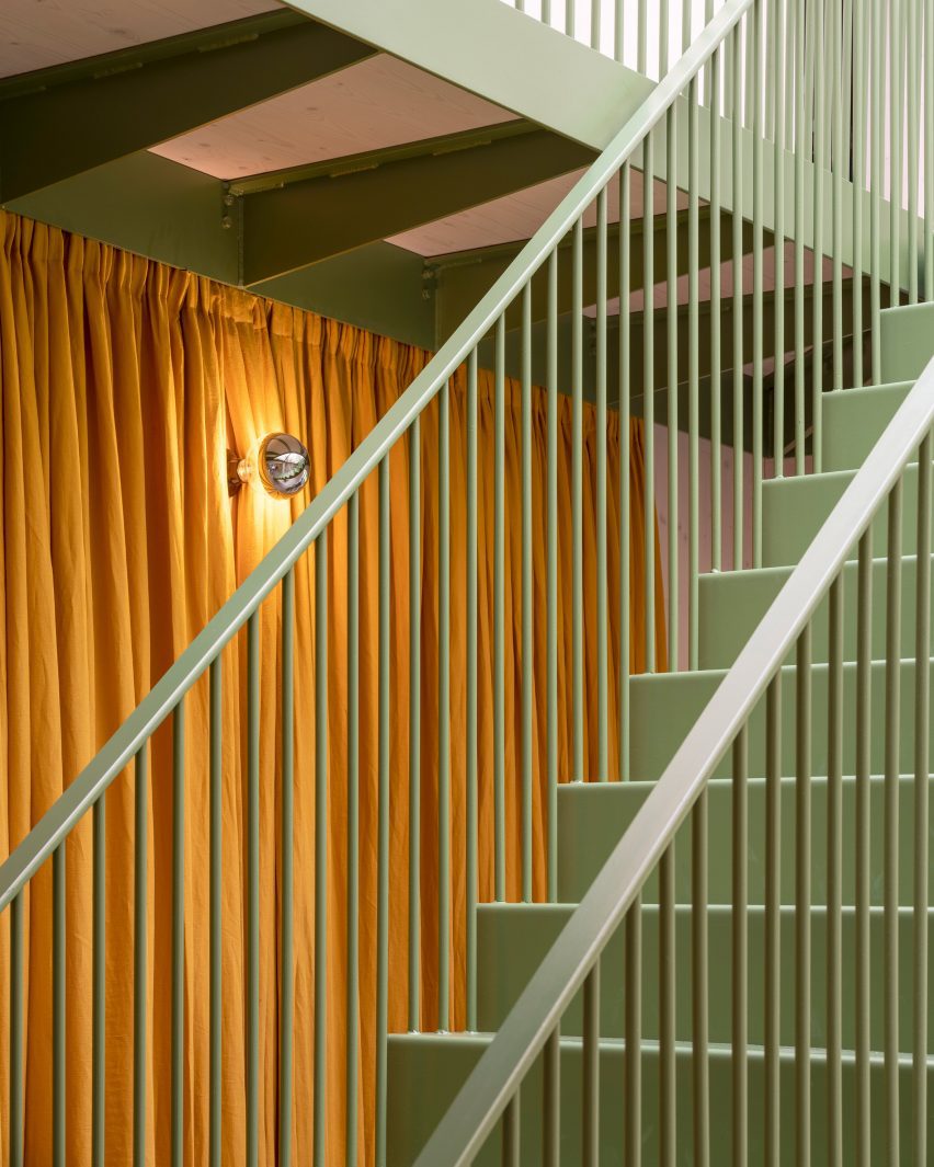 Green-painted metal staircase