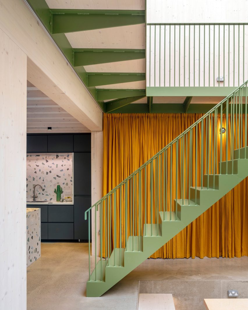 Green-painted stairs at Green House by Hayhurst and Co