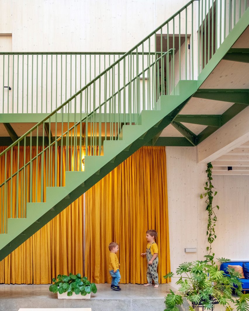Atrium with a green-painted staircase