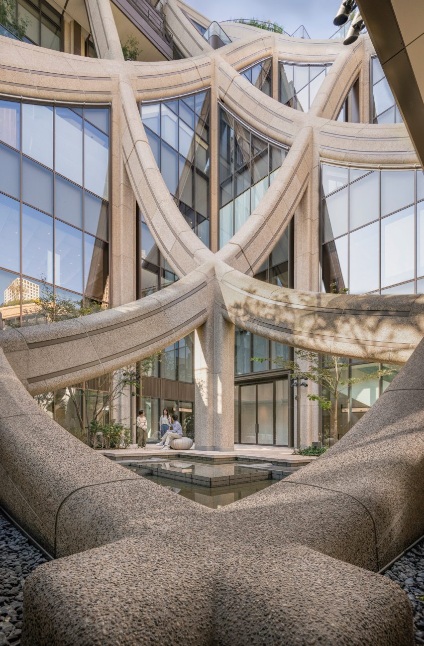 Curving grid roof structure at Azabudai Hills in Tokyo by Heatherwick Studio