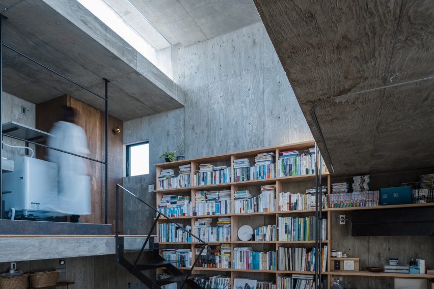 Bookcase wall in a concrete home