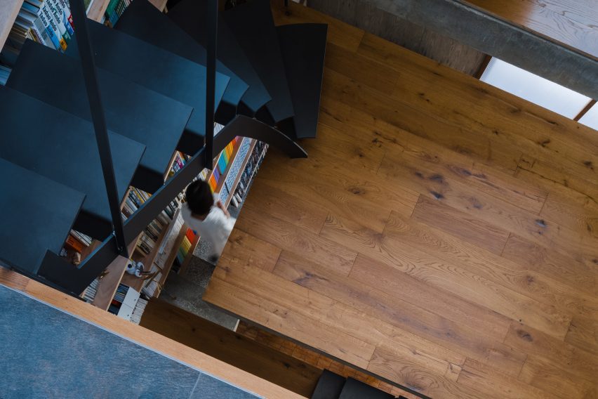 Black metal staircase in a home with wood flooring