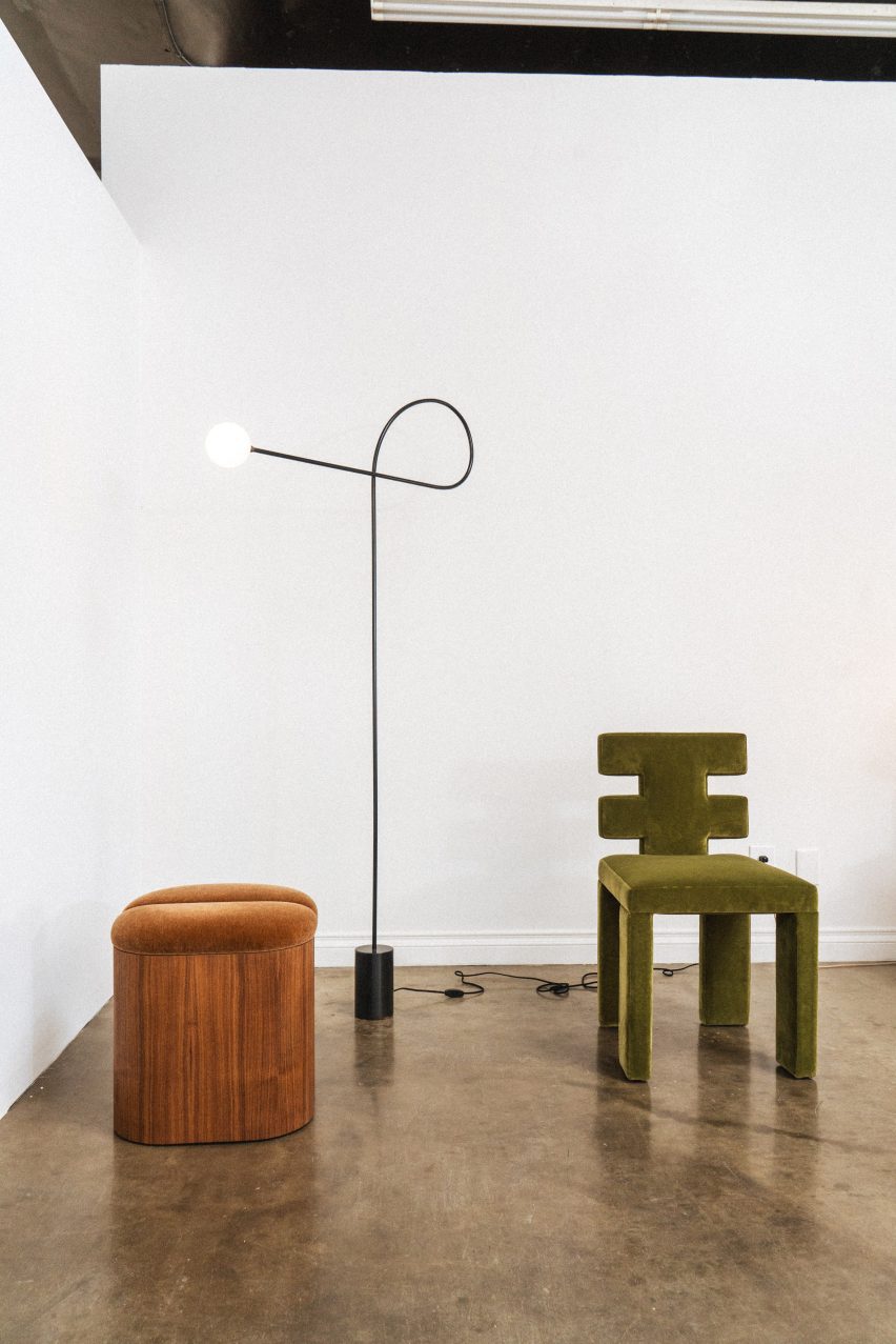 A velvet chairs and spinny lamp