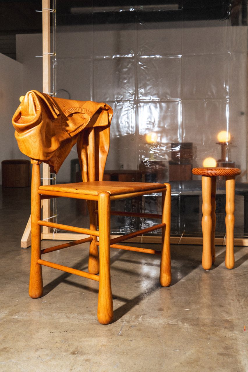 A wooden chair with carved wood sweater