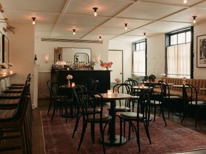 Bar with clusters of small tables and chairs