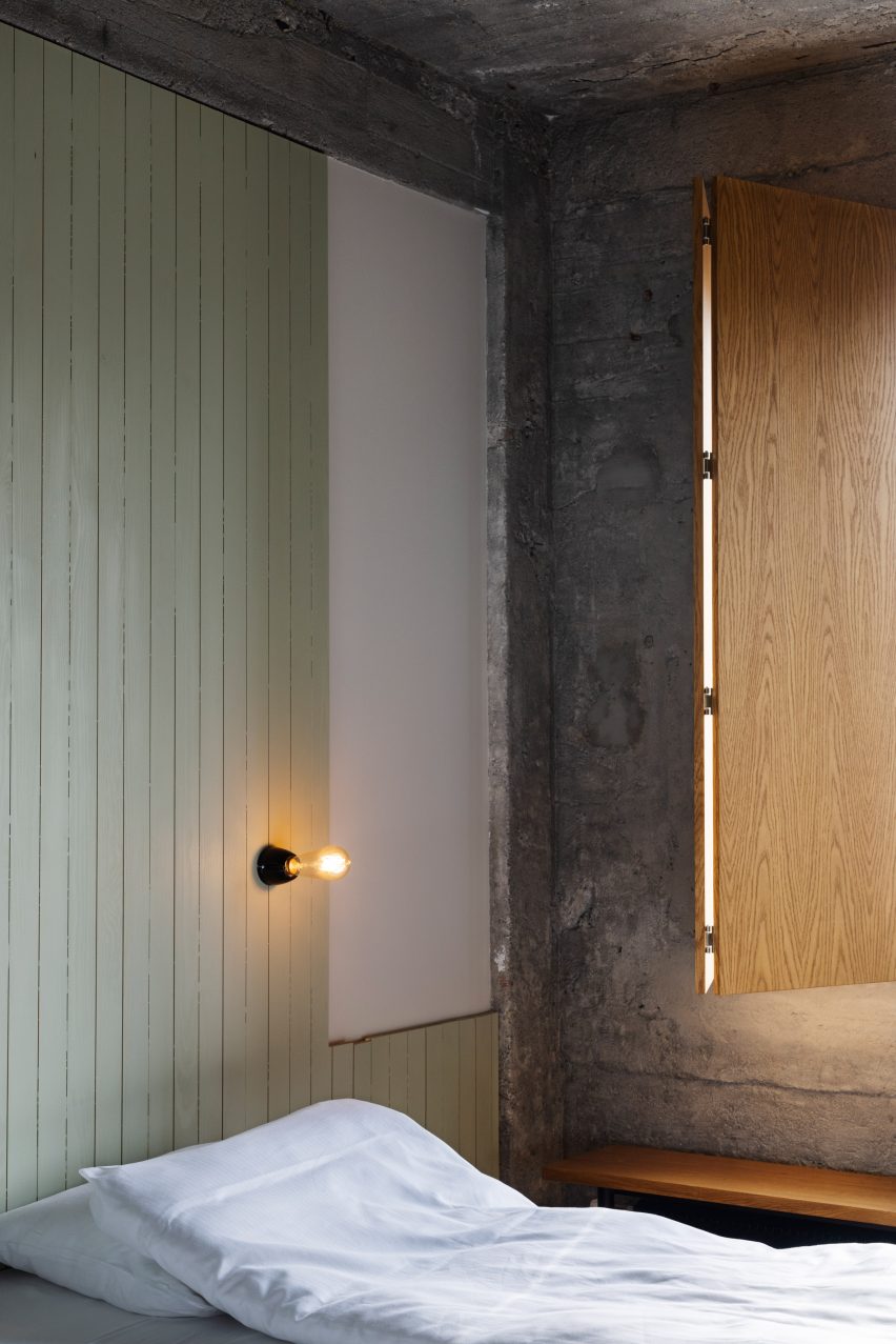 Bedroom interior of the Trevarefabrikken hotel by Jonathan Tuckey Design