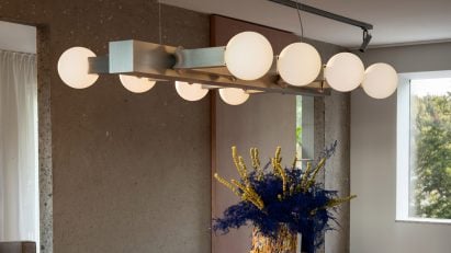 Metal chandelier above dining table