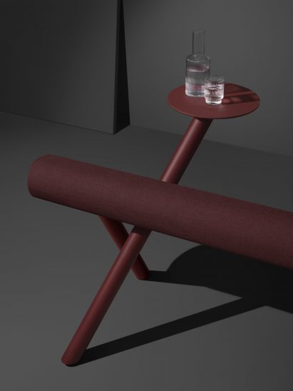 Burgundy perch seat with table holding water glass and decanter