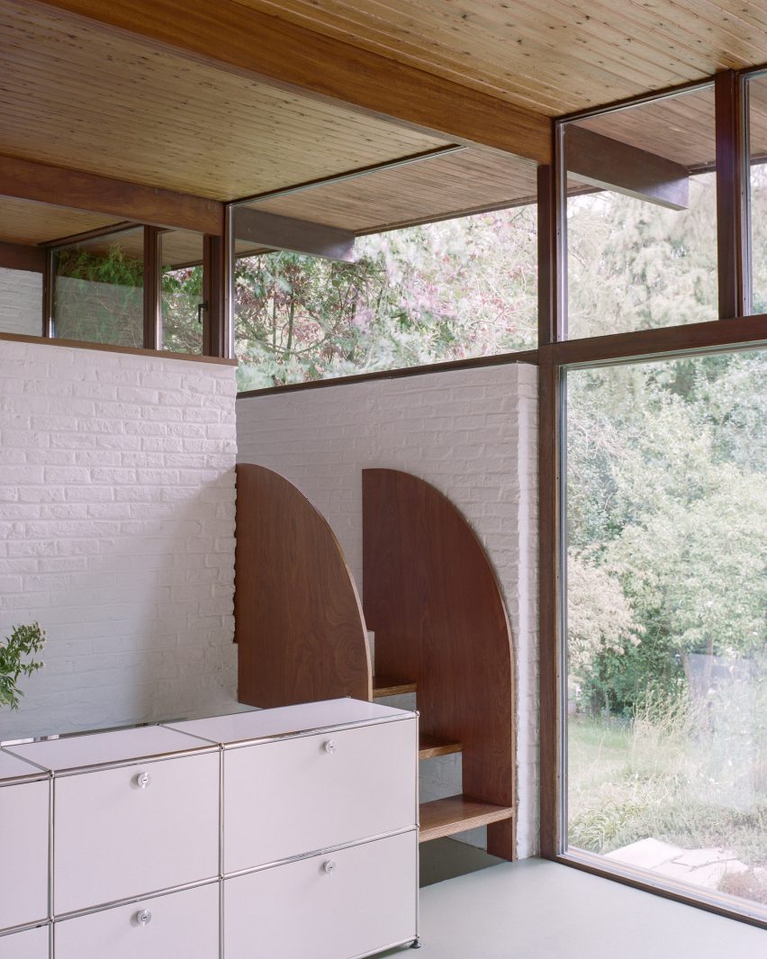 Interior with white brick walls, clerestory windows and timber steps