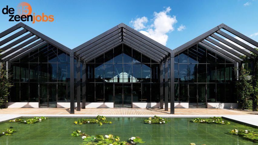Photograph of black building with pitched roofs
