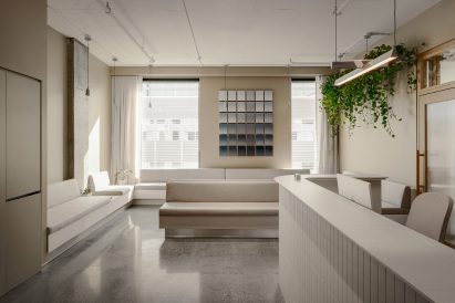 Minimalist reception area with built-in lounge seating