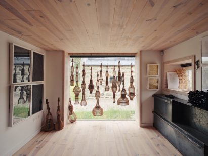 Interior view of artist's studio with maritime pine and design work by Naomi Mcintosh