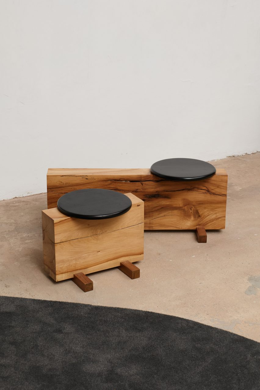 Wooden benches with black circular seat