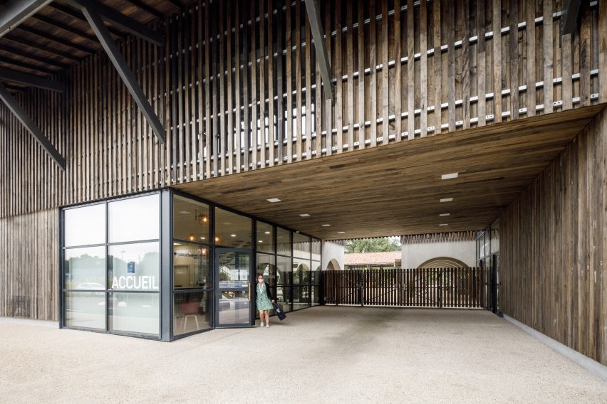 Entrance to the timber-clad Alzheimer's Village in France by NORD Architects