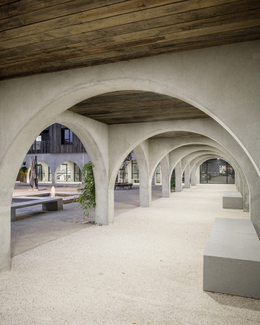Wide concrete archways surrounding a courtyard