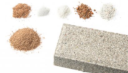 YiBrick Permeable by Yi Design next to piles of ceramic waste