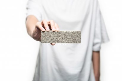 Person holding YiBrick Permeable by Yi Design