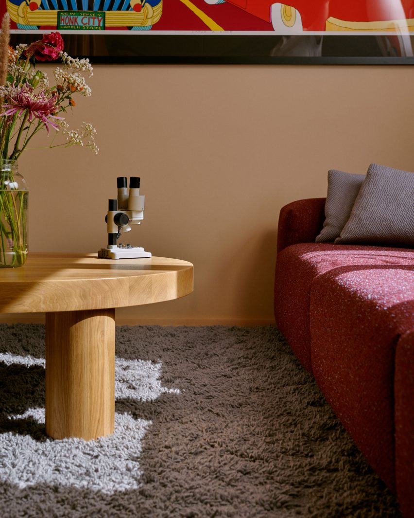 Plum coloured sofa in Kvadrat textiles
