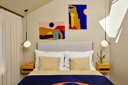 Bedroom with wall carpets by Familien Kvistad