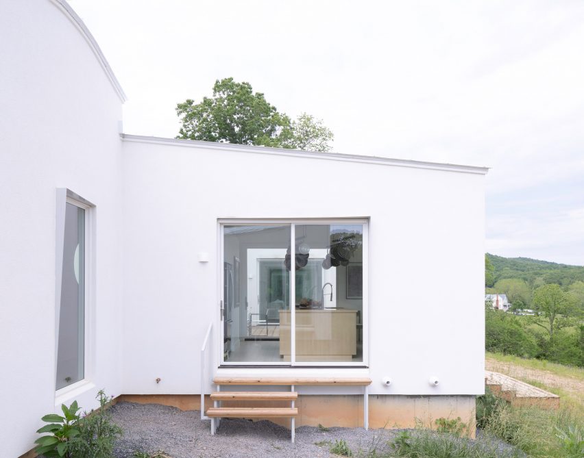 Stairs leading into sliding glass doors