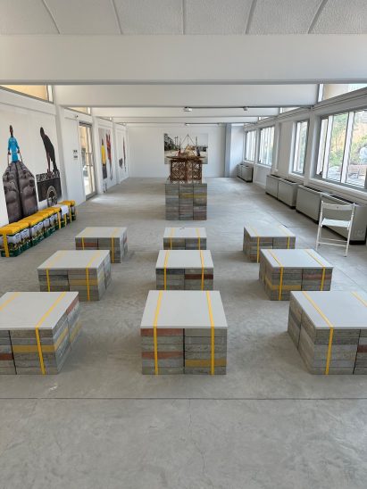 Exhibition displays are created from stacks of construction material