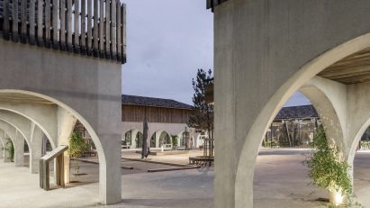 Arched colonnade at the Alzheimer's Village in France by NORD Architects