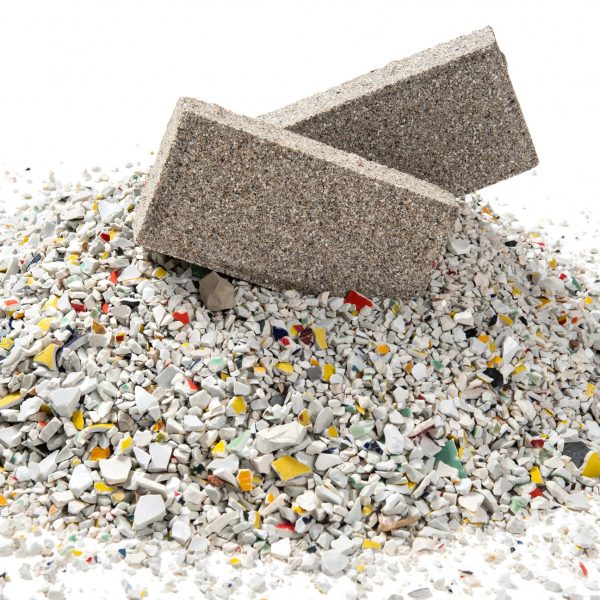 YiBrick Permeable by Yi Design on a pile of ceramic waste