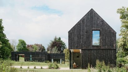 Loader Monteith adds charred-timber-clad office to brownfield site in Inverness