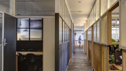 Interior view of corridor and workspace in TERRIOR's Hobart office