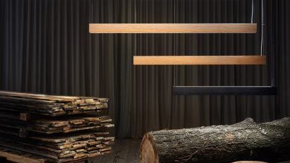 Linear lights hanging over reclaimed wood timber and stumps