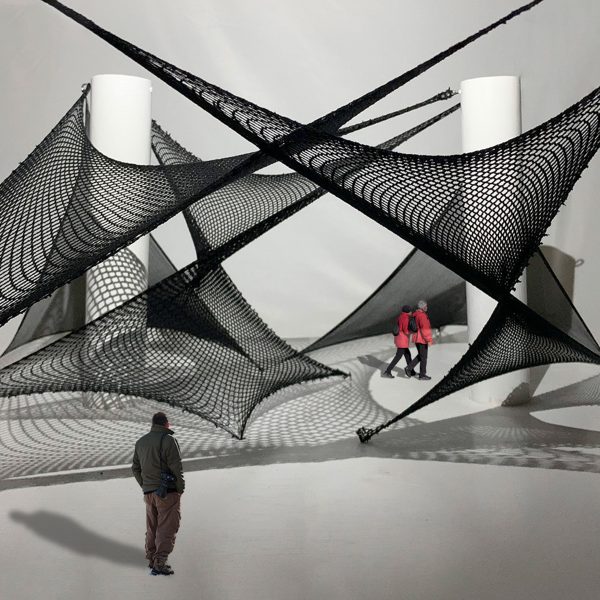 Figures walking through an exhibition