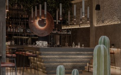 Tapas restaurant with concrete walls and central bar counter