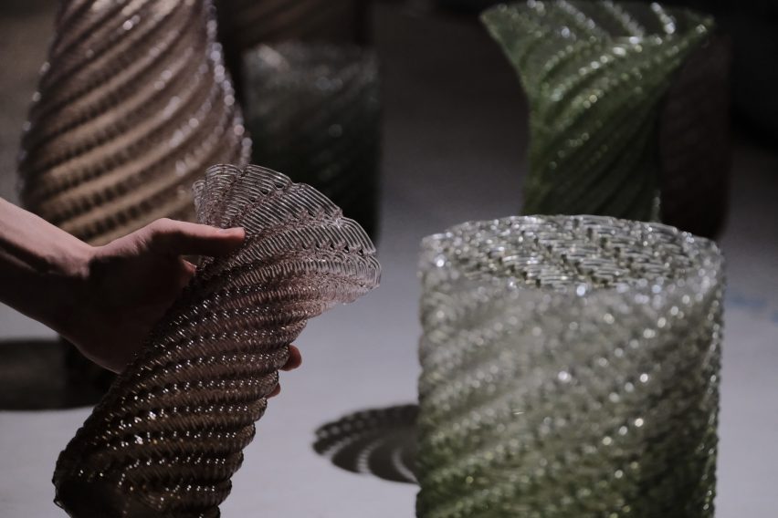 Hand holding lilac 3D-printed vase