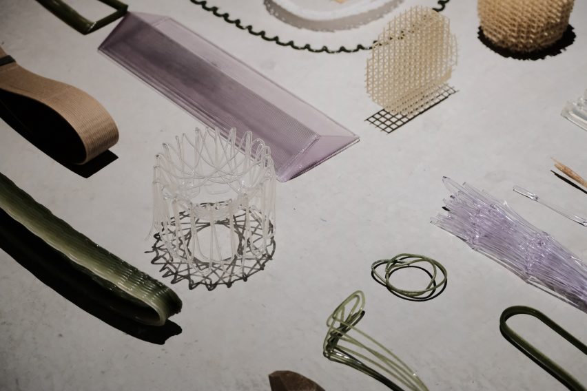 3D-printed artefacts laid out on concrete floor