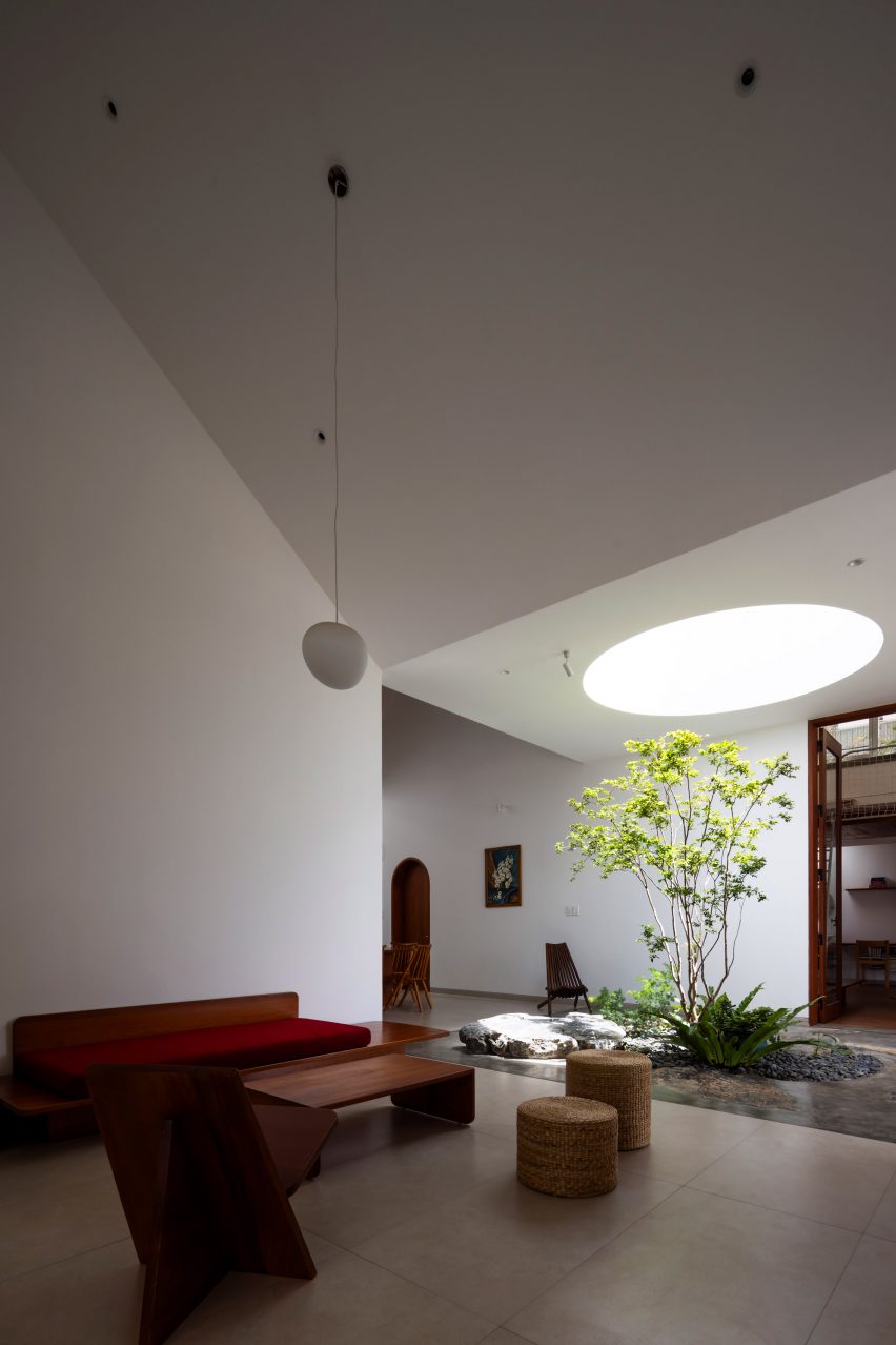 White living room with a circular skylight