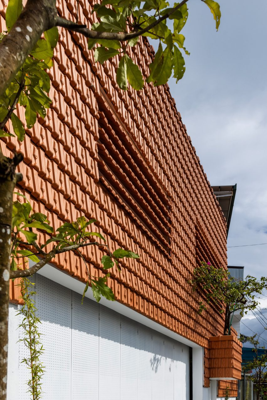 Red-tiled wall at Tile House by The Bloom Architects
