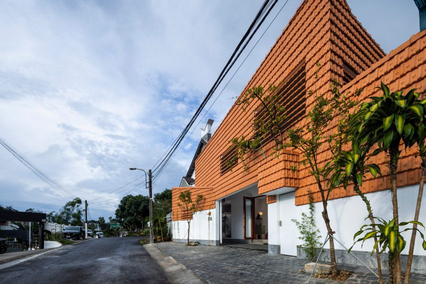 Exterior of a red-tiled house by The Bloom Architects