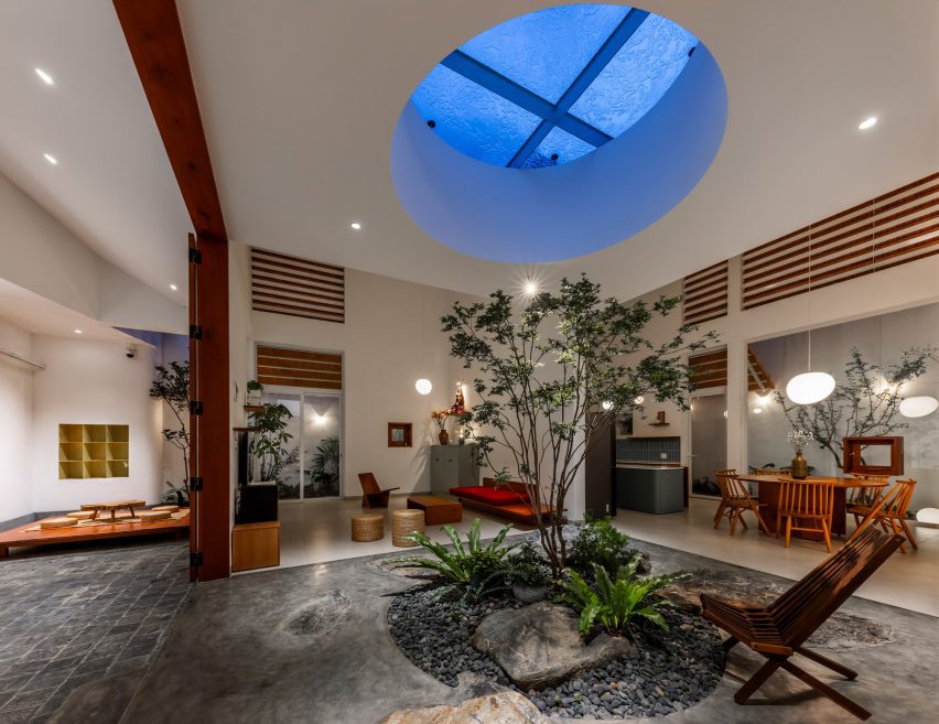 Internal living space with an oculus and planted tree